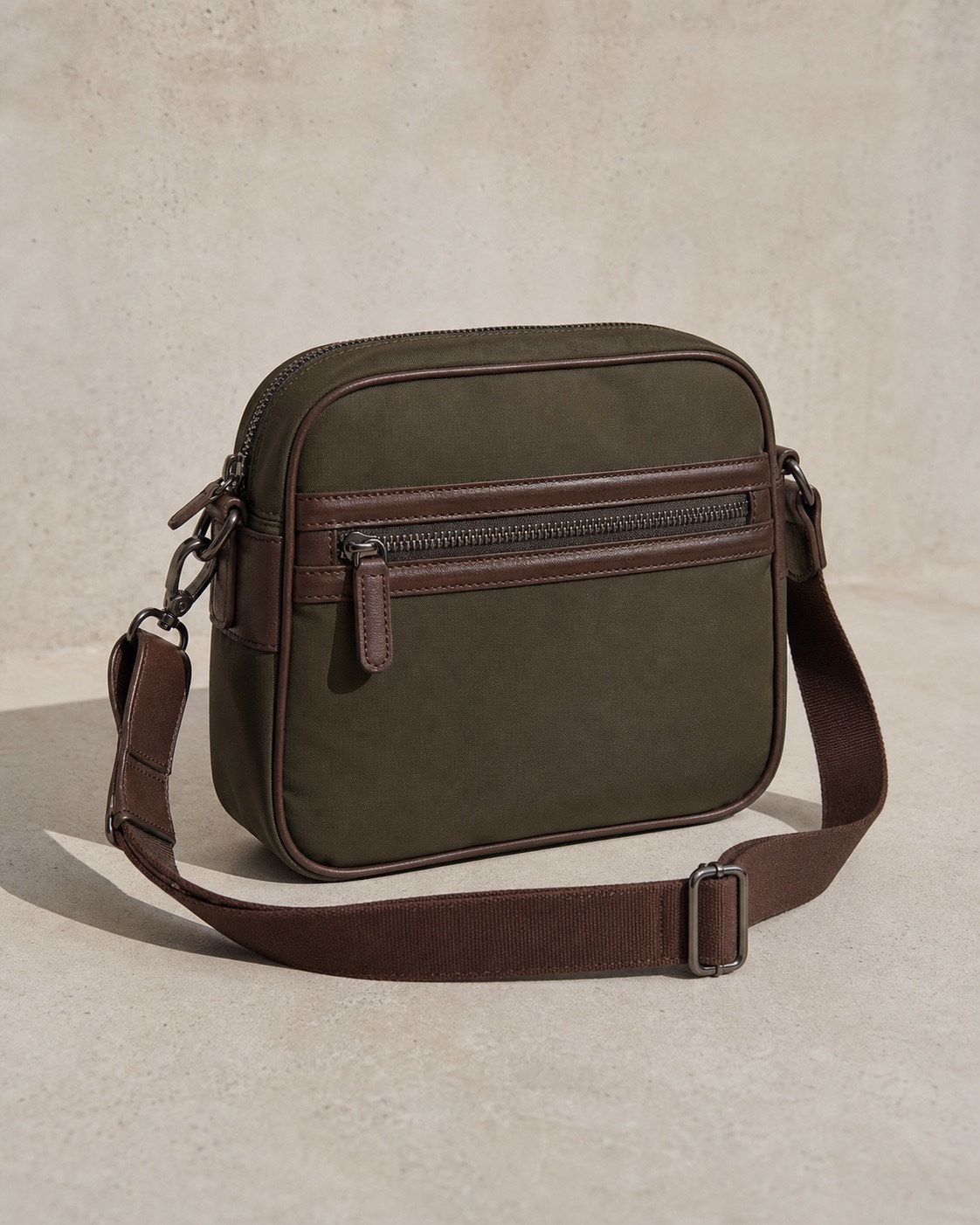 Compact olive KOLLETTE crossbody travel bag.